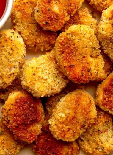 Cozy healthy chicken nuggets served with a side of vegetables