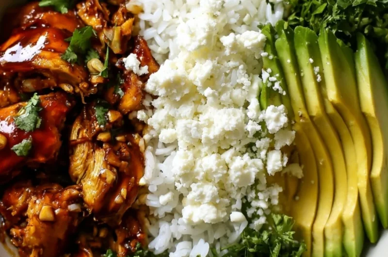 Honey Lime Chicken served in a bowl with avocado rice and fresh ingredients.